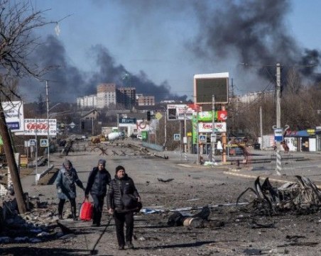 Украйна: 57 души са били погребани в масов гроб в Буча